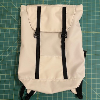 Front view of completed Clare's Eleven Fifteen Daypack against cutting mat